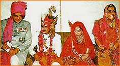 A family picture at the wedding of the Maharaj Kumari. 
(left to right) The Maharaja Sawai Bhawani Singh, Narendra Singh Rajawat, Maharaj Kumari Diya Kumari, Maharani Padmini Devi. 