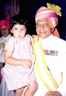 His Higness Maharaja Brigadier Sawai Bhawani Singh with his grand daughter. She is the daughter of Princess Diya Kumari and Kumar Narendra Singh. 