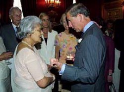 Britain's Prince of Wales talks to the Rajmata of Jaipur at a reception for supporters of Friends of Conservation, in the State Apartments at St. James Palace in London, on Tuesday June 25, 2002